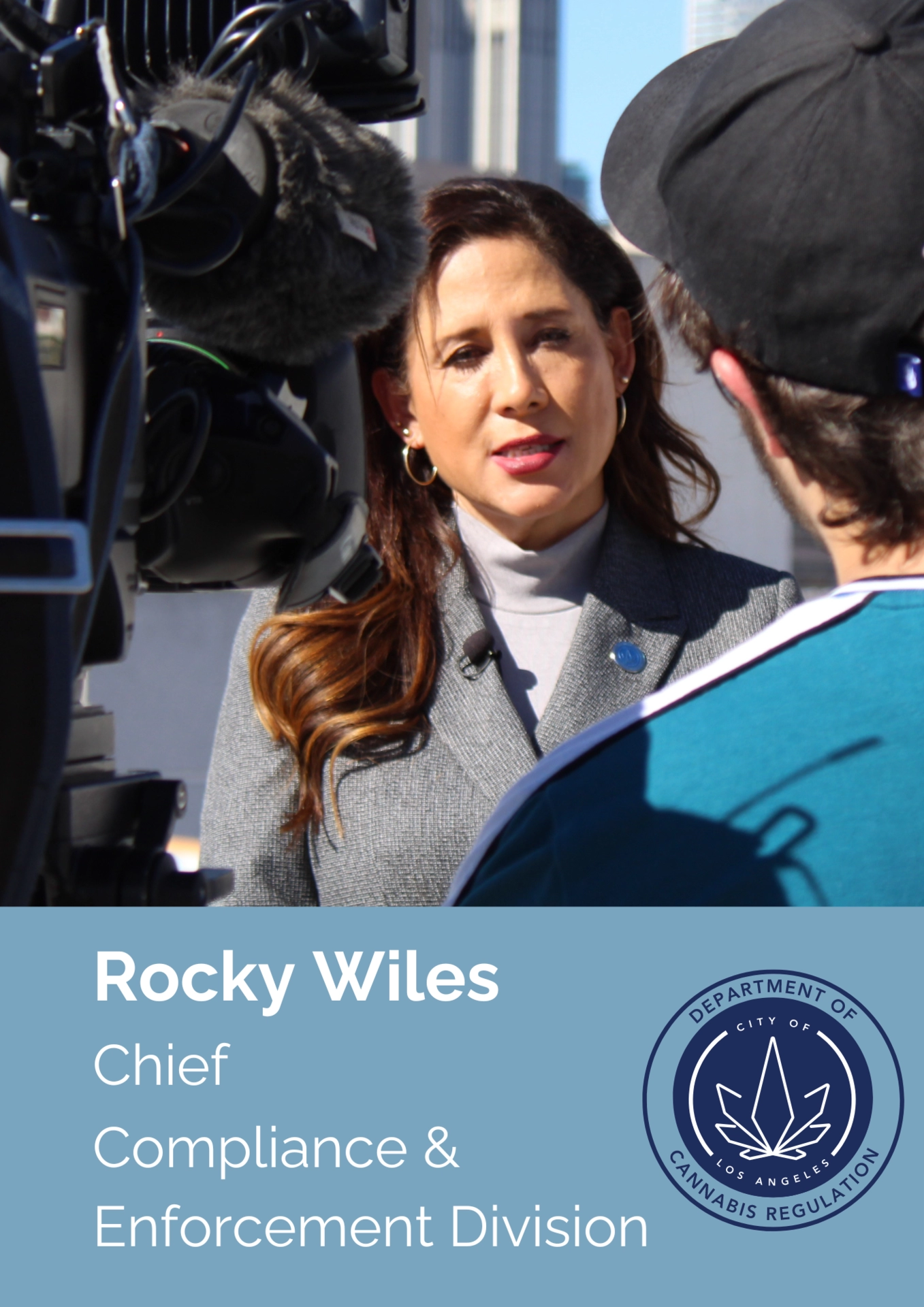 Image of Rocky Wiles being interviewed with television cameras in front