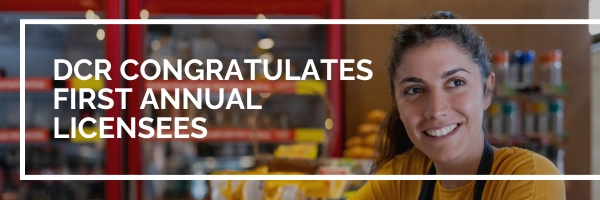 female shop owner smiling in store