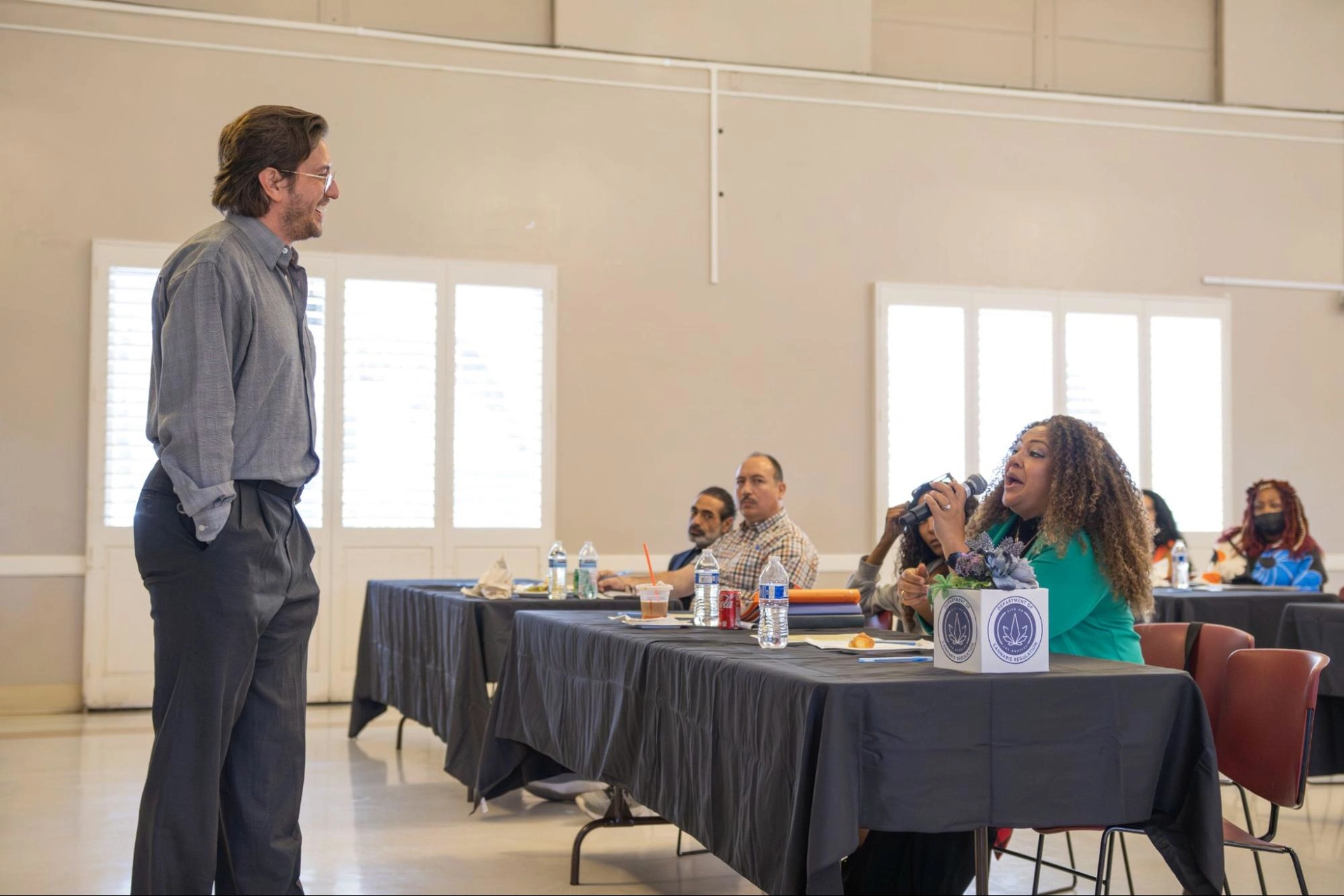 man facilitating in front of an attentive audience